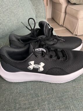 Under Armour Black and White Women's Charged Surge sneakers